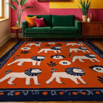 A vibrant hand-tufted area rug featuring playful lion motifs on a rich orange background, perfect for adding charm to a dining room. This wool rug complements modern decor with its bold design, ideal as a dining table rug or dining room carpet.