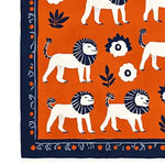 Vibrant Lion's Parade Hand Tufted Area Rug featuring playful lion designs with bold orange and navy hues. Perfect as a dining table rug or dining room carpet, this wool rug adds charm and warmth to any dining room setting.