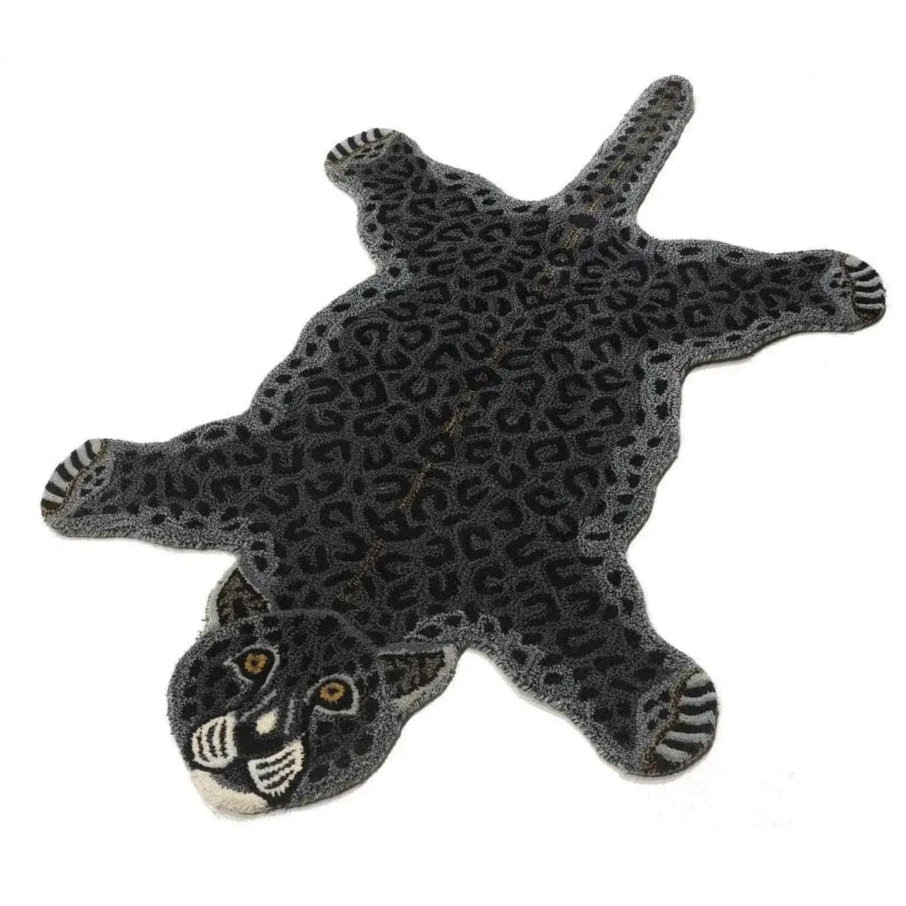 A stylish hand-tufted wool rug shaped like a black leopard, perfect for adding a unique touch to living room area rugs. This large area rug showcases intricate details and a plush texture, making it an ideal choice for area rugs for the living room.