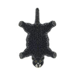 Top view of a Little Black Leopard Hand Tufted Wool Rug, ideal for living rooms. This large area rug features a unique leopard design, adding a touch of elegance to any living room decor. Perfect choice for those seeking stylish and cozy wool rugs in their living spaces.
