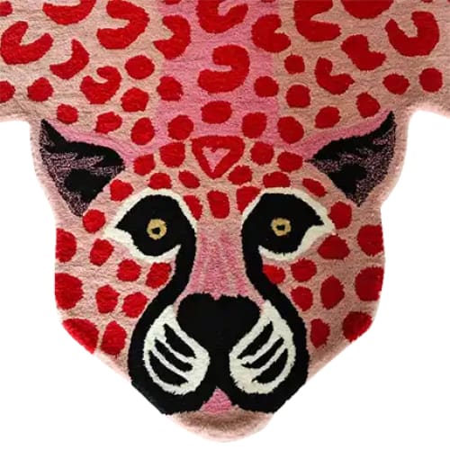 This vibrant Little Pink Leopard Hand Tufted Wool Rug features a bold leopard face design with red and pink spots, making it a striking addition to any living room or bedroom. Perfect as an area rug, this 8x10 wool rug adds a playful touch to your decor, ideal for those seeking unique living room rugs or stylish rugs for the bedroom.