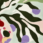 Top view of a contemporary area rug featuring an abstract design with bold colors including green, purple, red, and pastel shades. This wool rug is perfect for adding a touch of modern elegance to any living room. Ideal as an 8x10 rug for living spaces.