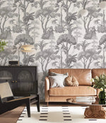 Living room with Grey Forest Serenity Wallpaper, tan leather sofa and black cabinet
