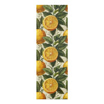 Long 24x72 yoga mat printed with sliced lemons and green leaves on a cream background