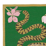Close-up view of the Lotus and Indian Tiger Hand Tufted Wool Rug in green, showcasing a vibrant tiger stripe pattern intertwined with delicate pink flowers. This wool rug is ideal for dining rooms, adding a touch of boho style to large area spaces, perfect for both living room and dining room settings.