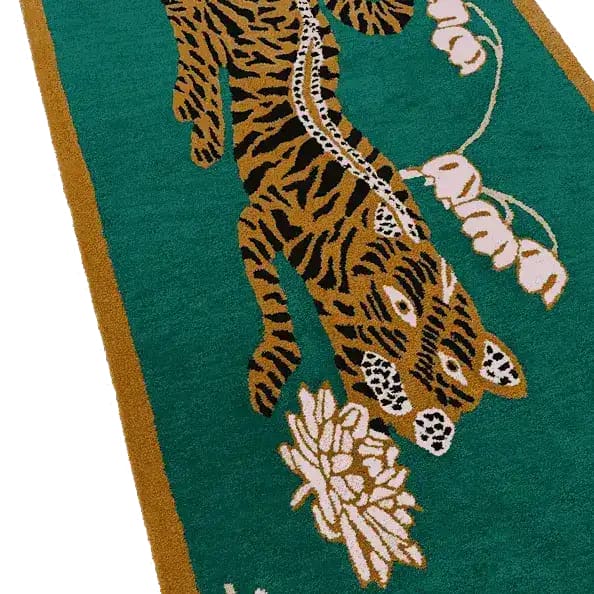 This vibrant Area Rug features an intricate design of a lotus and Indian tiger on a lush green background. Perfect for adding a touch of elegance to your dining room, this wool rug serves as a stunning boho rug centerpiece. Ideal for large spaces, it complements both living room and dining room carpets with its eye-catching details.