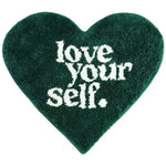 The Love Yourself Heart-Shaped Bath Rug is a charming and cozy addition to your bathroom décor. Designed in a delightful heart shape, it radiates warmth and positivity, reminding you to embrace self-love every day. Crafted from ultra-soft, absorbent materials, this rug offers comfort underfoot while keeping your bathroom floor dry and slip-free. Its vibrant colors and plush texture make it both functional and stylish, adding a playful yet elegant touch to your space. Perfect for creating a welcoming and upl