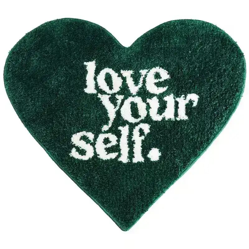 The Love Yourself Heart-Shaped Bath Rug is a charming and cozy addition to your bathroom décor. Designed in a delightful heart shape, it radiates warmth and positivity, reminding you to embrace self-love every day. Crafted from ultra-soft, absorbent materials, this rug offers comfort underfoot while keeping your bathroom floor dry and slip-free. Its vibrant colors and plush texture make it both functional and stylish, adding a playful yet elegant touch to your space. Perfect for creating a welcoming and upl