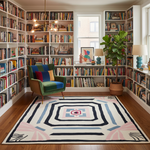 Library with bookshelves, a colorful rug, and a green armchair.