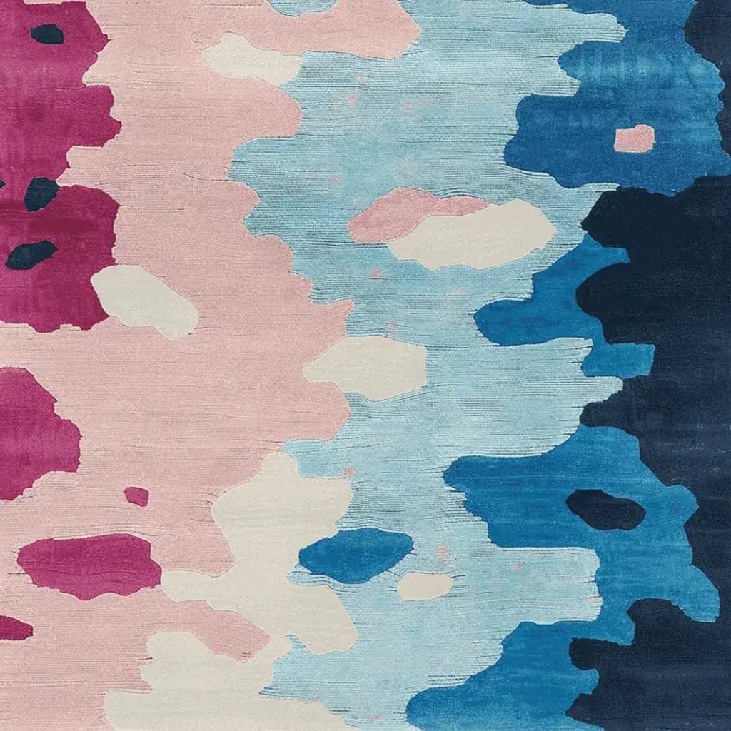 This vibrant area rug features a contemporary abstract design with splashes of pink, blue, and cream, perfect for adding a modern touch to your living room. Crafted from high-quality wool, this 8x10 rug is both stylish and durable, making it an ideal choice for contemporary decor enthusiasts.