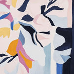 A vibrant Luminous Bloom Flow hand-tufted area rug showcasing an abstract floral design with bold colors. This contemporary wool rug is perfect for adding a splash of color to large living room spaces. Ideal for those seeking stylish area rugs for living rooms.