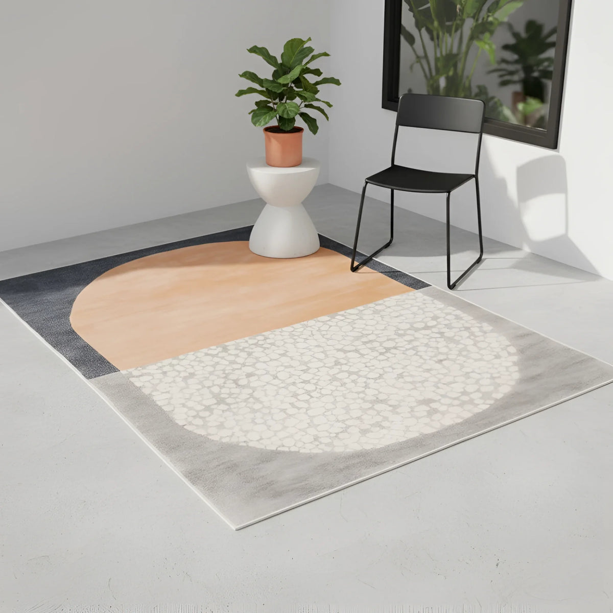Rug with geometric pattern on a light gray floor, featuring a chair and plant in the background.