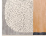 This image features a close-up view of the Lunar Divide Hand Tufted Wool Rug, showcasing its intricate design. The area rug is ideal for living room spaces, measuring 8x10 feet, and highlights a contemporary flair with floral elements. The wool rug combines soft textures with a blend of neutral and warm tones, making it a perfect choice for those seeking stylish living room area rugs.