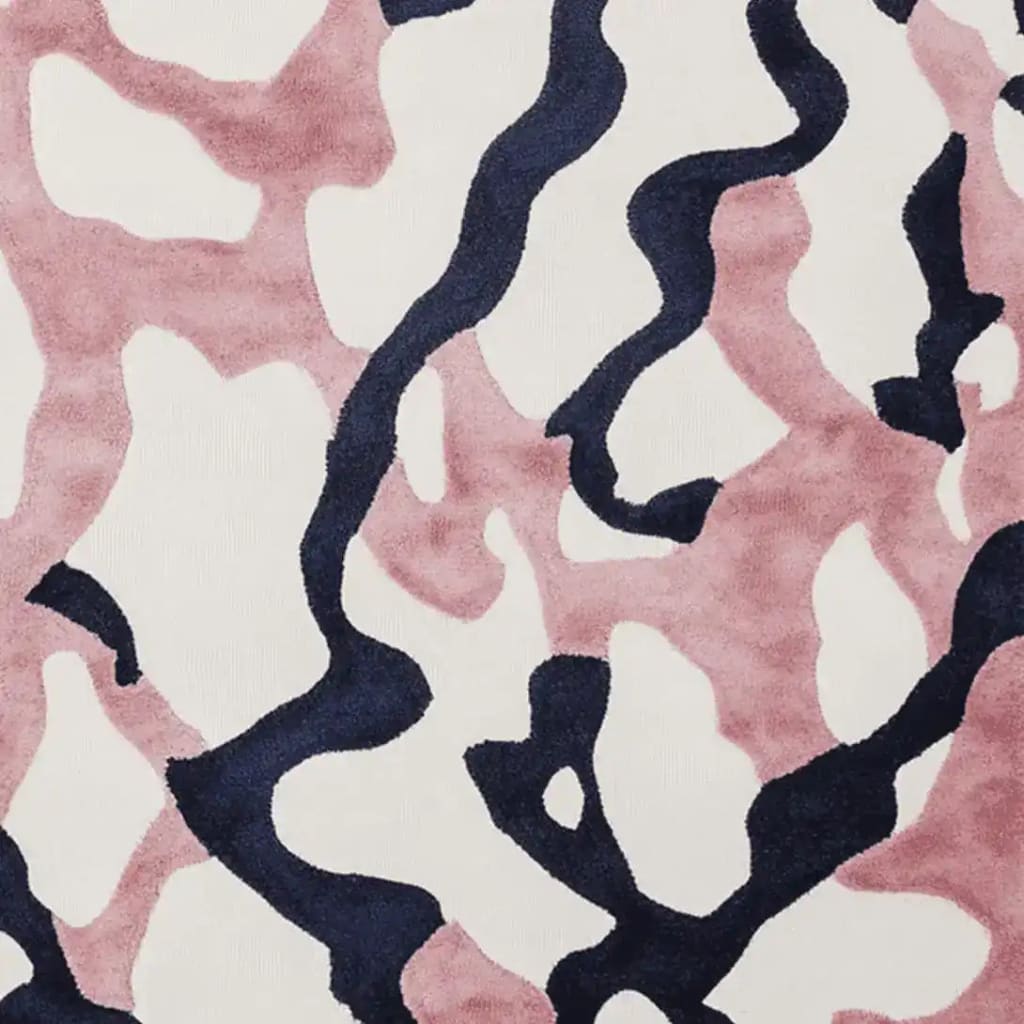 Close-up view of the Lush Fragment Field Hand Tufted Area Rug, featuring a contemporary abstract design in soft pink and deep navy, perfect for a modern touch in living rooms. This wool rug is ideal for those seeking stylish 8x10 rugs for living room spaces.