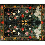 Lush Garden Retreat Hand Tufted Area Rug showcasing a vibrant floral design with rich reds, yellows, and greens on a dark background. Perfect for adding elegance to a dining room or bedroom, this wool rug brings a touch of nature indoors, ideal for formal dining room settings or as an eye-catching floral rug in the bedroom.