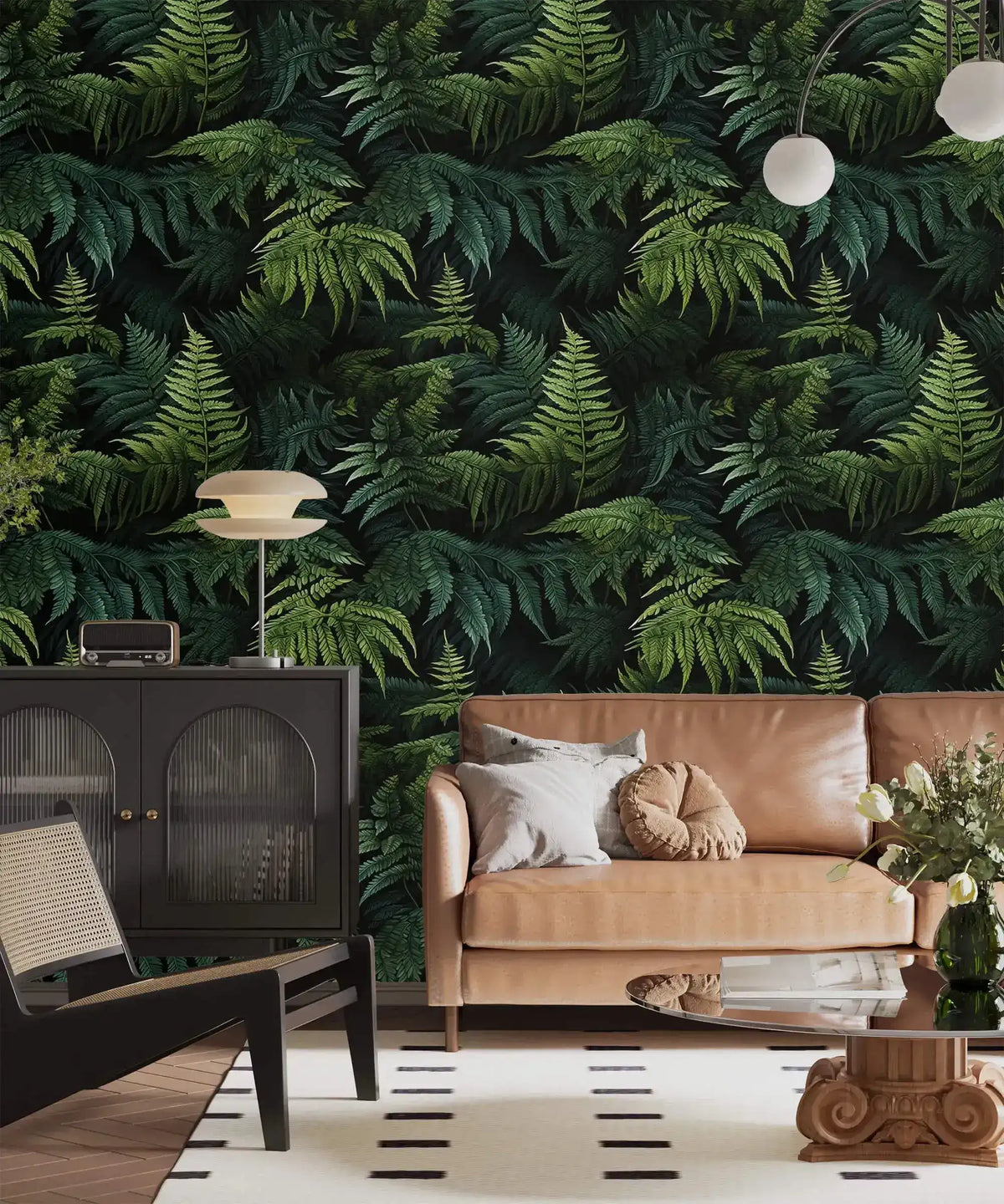 Lush green fern jungle wallpaper in living room with tan leather loveseat and black cabinet