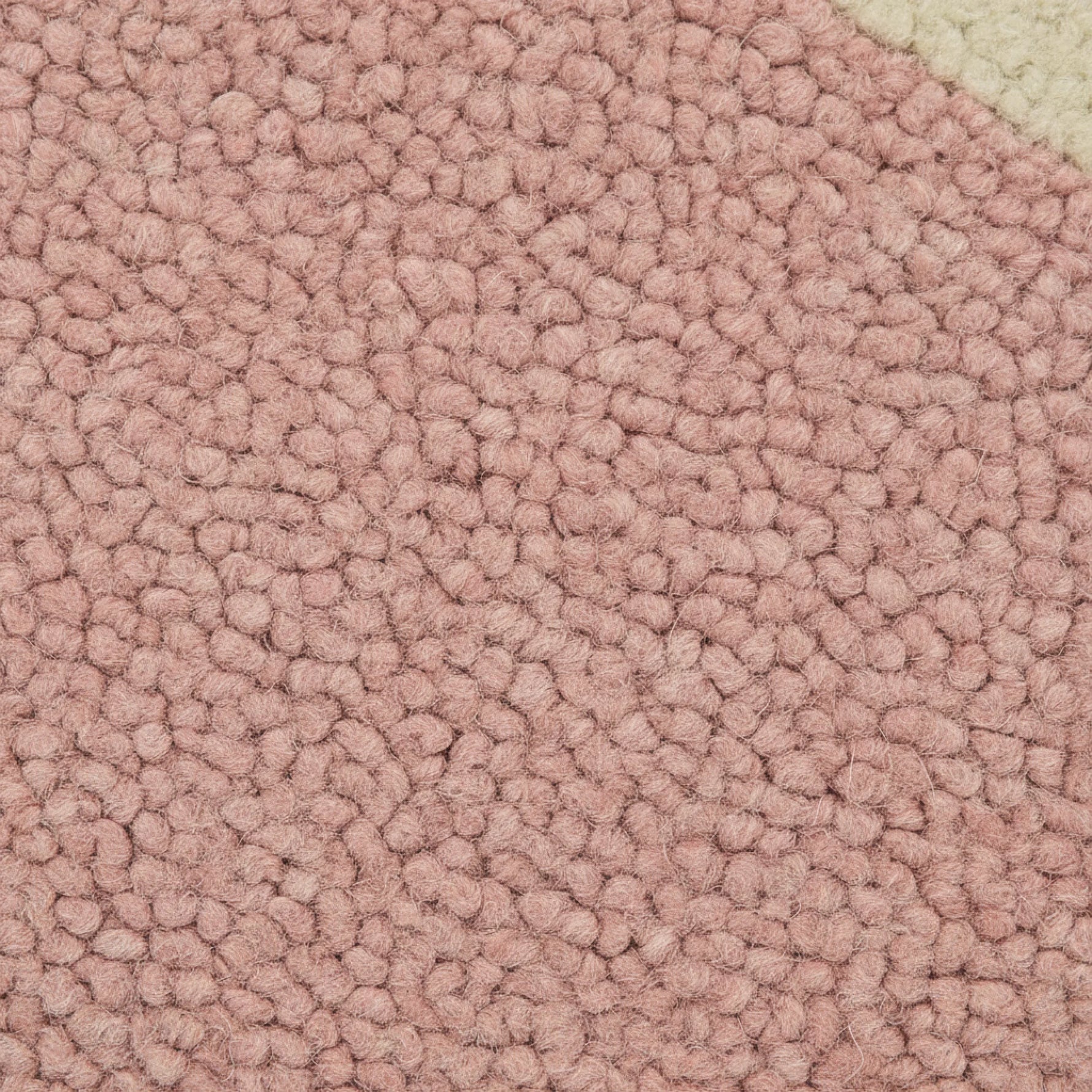 Close-up of pink textured carpet