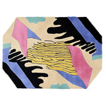 This contemporary area rug features a vibrant abstract design with bold splashes of yellow, pink, and blue, perfect for adding a modern touch to any living room. Crafted from high-quality wool, this large living room rug combines durability with style, making it an ideal choice for those seeking both function and flair in a hand-tufted wool rug.