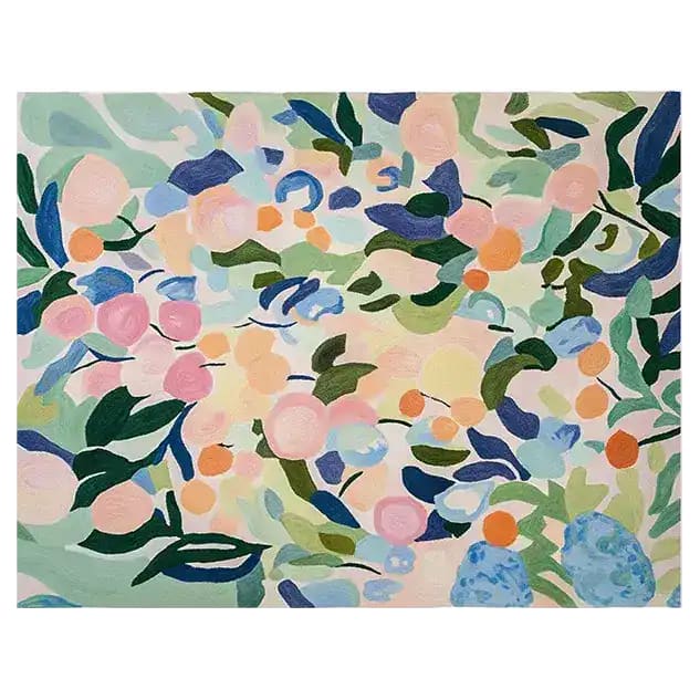 A vibrant and contemporary area rug featuring a lush painted meadow design. This hand-tufted wool rug showcases a blend of colorful abstract floral patterns, perfect for adding a splash of color to large living rooms.