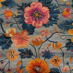 A close-up of the Lush Petal Elysium Hand Tufted Area Rug, showcasing its intricate floral pattern in vibrant shades of pink, orange, and blue. This contemporary wool rug is perfect for adding a touch of vintage charm to dining rooms or living room spaces. Ideal as an 8x10 living room rug or dining room carpet, it brings elegance and warmth to any setting.