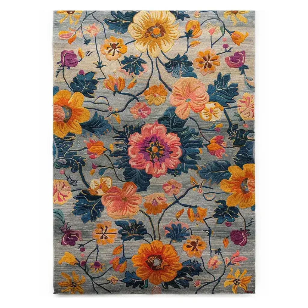 The Lush Petal Elysium Hand Tufted Rug is a vibrant area rug featuring a stunning floral design with bold, colorful blooms. Perfect for adding a touch of elegance to dining room spaces or as an 8x10 living room rug, this contemporary wool rug blends vintage charm with modern style. Ideal for dining room carpets and living room decor, the intricate floral patterns in rich hues create a warm and inviting atmosphere.