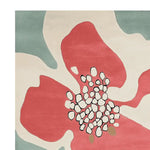Vibrant contemporary wool area rug featuring a large abstract floral design in red, cream, and teal. Perfect for adding a pop of color to living room spaces, especially in an 8x10 size.