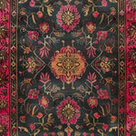 A beautifully intricate Luxe Crimson Labyrinth Hand Knotted Area Rug showcasing a vintage floral design. The rug features vibrant crimson and gold floral patterns on a dark background, ideal for adding elegance to any living room space. Perfect for those seeking 8x10 Persian rugs that blend traditional charm with modern aesthetics.