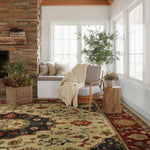 Cozy living room with a fireplace, persian rug, armchair, and decorative rug.