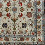 Luxurious Petal Weave Hand Knotted Area Rug featuring an intricate floral design with vibrant colors, evoking a vintage Persian rug style. Perfect for adding a touch of elegance to living rooms, this 8x10 floral rug showcases detailed patterns and a rich tapestry of hues.