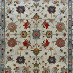 Luxurious Petal Weave Hand Knotted Area Rug featuring a vintage floral design with intricate Persian patterns. This 8x10 living room rug displays a harmonious blend of earthy tones and vibrant reds, adding elegance and warmth to any space.