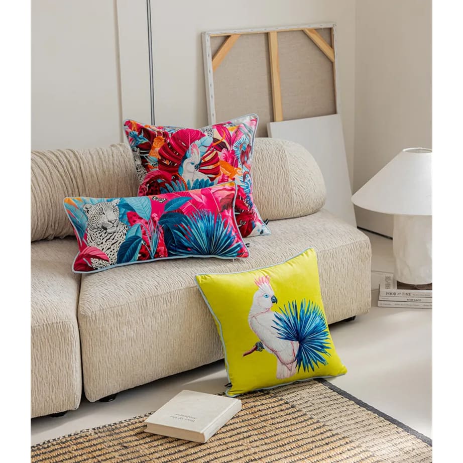 Luxurious tropical throw pillow featuring a vibrant cockatoo design, perfect for adding a pop of color to any living space.