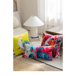 Luxurious throw pillow featuring vibrant tropical cockatoo design, perfect for adding a pop of color to any living space.