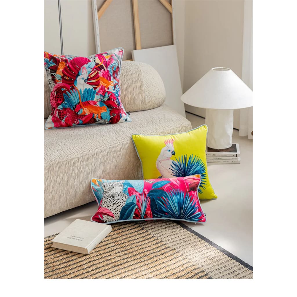 Luxurious tropical throw pillow featuring vibrant cockatoo and floral designs, perfect for adding a pop of color to your living space.