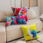 Luxurious tropical throw pillow featuring a vibrant cockatoo design surrounded by colorful foliage, perfect for adding a pop of exotic style to any decor.