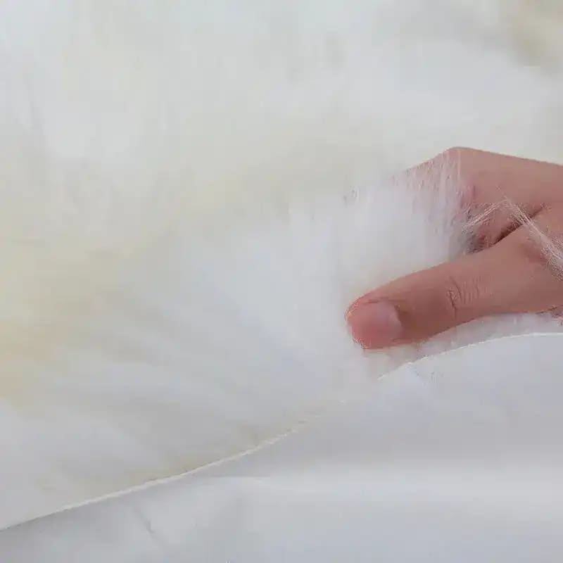 Close-up image of a luxury plush sheepskin area rug, showcasing its soft texture. Ideal for large living room rugs, particularly in an 8x10 size, this rug adds a touch of elegance and comfort to any space.