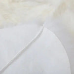 Close-up view of a luxurious plush soft sheepskin rug, showcasing its fine texture and quality. Ideal as a large living room rug, perfect for those seeking elegant and cozy living room rugs 8x10.