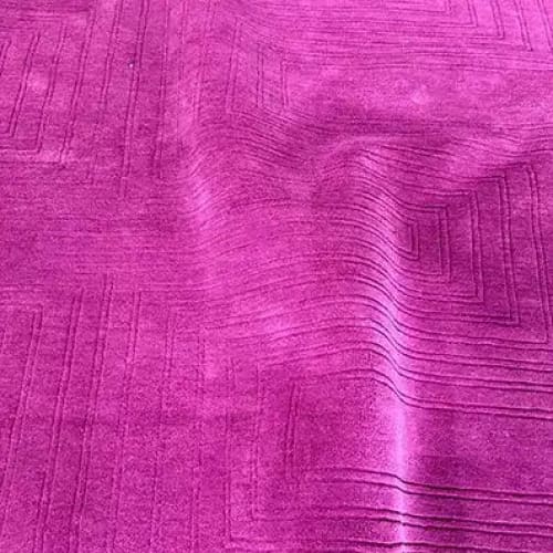 A vibrant magenta area rug with an intricate geometric pattern, perfect for adding a touch of elegance to a dining room. This contemporary wool rug is ideal for those seeking stylish dining room carpets or large area rugs for a formal dining setting.