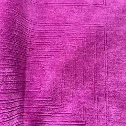 Vibrant magenta area rug featuring a modern geometric design, perfect for adding a contemporary touch to dining room spaces. This hand-tufted wool rug serves as an elegant backdrop for formal dining room settings, showcasing its rich texture and large area coverage.