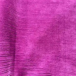 Vibrant magenta area rug featuring a modern geometric design, perfect for adding a contemporary touch to dining room spaces. This hand-tufted wool rug serves as an elegant backdrop for formal dining room settings, showcasing its rich texture and large area coverage.