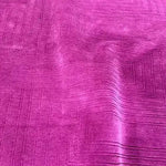 A vibrant magenta area rug with an intricate geometric pattern, perfect for adding a touch of elegance to a dining room. This contemporary wool rug is ideal for those seeking stylish dining room carpets or large area rugs for a formal dining setting.