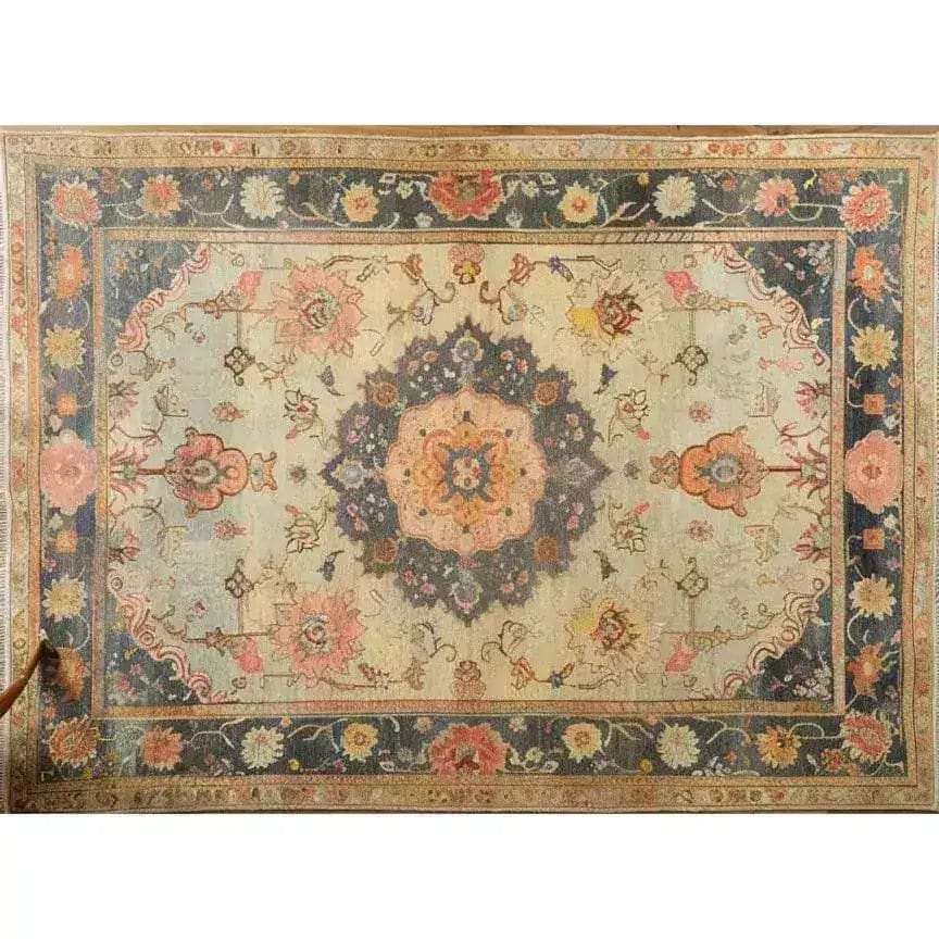 This image showcases a magnificent floral hand-knotted area rug, perfect for adding a vintage touch to your living room. The intricate design features a central medallion with vibrant floral patterns, reminiscent of traditional Persian rugs. The rug's rich colors and detailed craftsmanship make it an ideal choice for those seeking elegant area rugs for living room spaces.