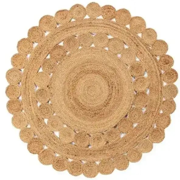 A beautifully crafted round jute rug, perfect for enhancing living room decor. This area rug features intricate circular patterns, offering a natural and earthy touch to any living room space.