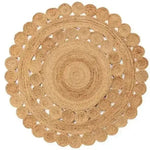 A beautifully crafted round jute rug, perfect for enhancing living room decor. This area rug features intricate circular patterns, offering a natural and earthy touch to any living room space.