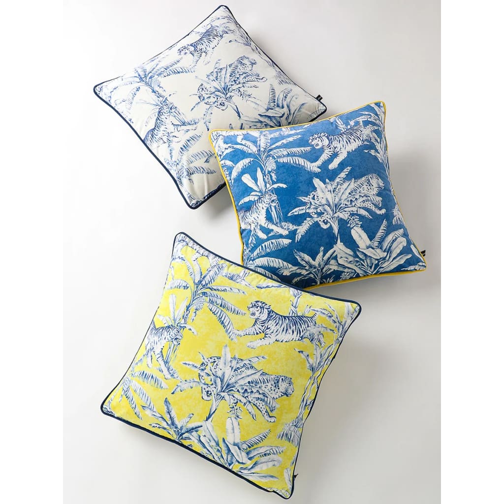 Exquisite jungle-print throw pillows featuring vibrant tiger and tropical leaf designs, perfect for home decor.