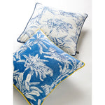 Exquisite jungle-print throw pillows featuring vibrant blue and white designs with tigers and tropical foliage, perfect for home decor.