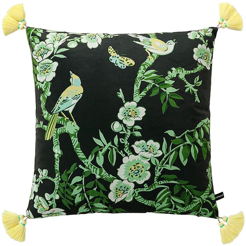 Decorative throw pillow featuring vibrant birds and floral patterns on a dark background, accented with yellow tassels.