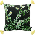 Decorative throw pillow featuring vibrant birds and floral patterns on a dark background, accented with yellow tassels.