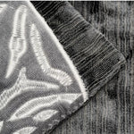 Luxurious black and gray throw pillow cover featuring elegant zebra embroidery, perfect for adding a touch of sophistication to any decor.