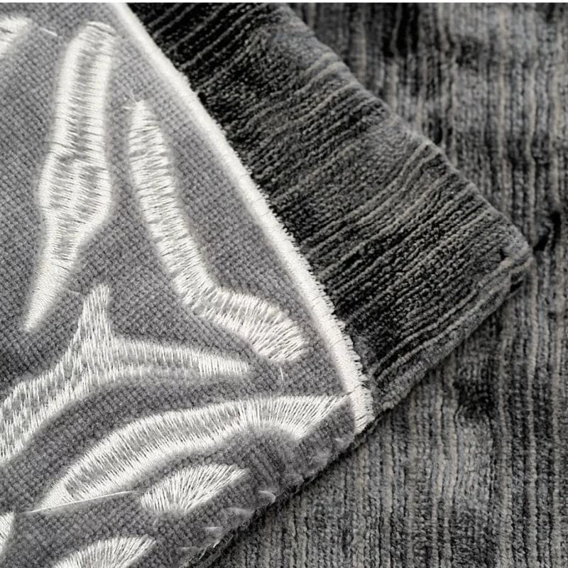 Luxurious black and gray throw pillow cover featuring elegant zebra embroidery, perfect for adding a touch of sophistication to any decor.