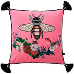 Pink throw pillow featuring a regal bee design surrounded by vibrant floral patterns and decorative tassels.